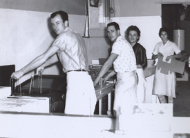 People making Paradise Donuts, historic